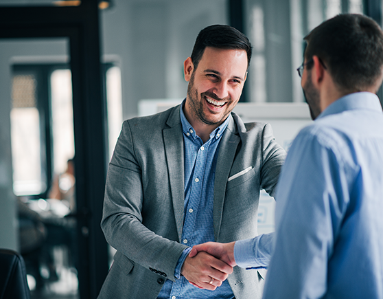 man shaking hands with business man