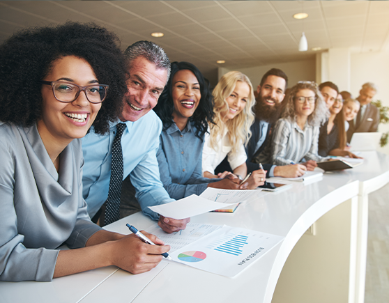 row of smiling business men and women