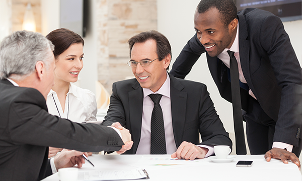 group of professionals shaking hands