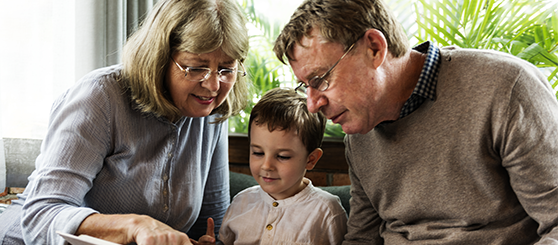 Grandparent with child reading